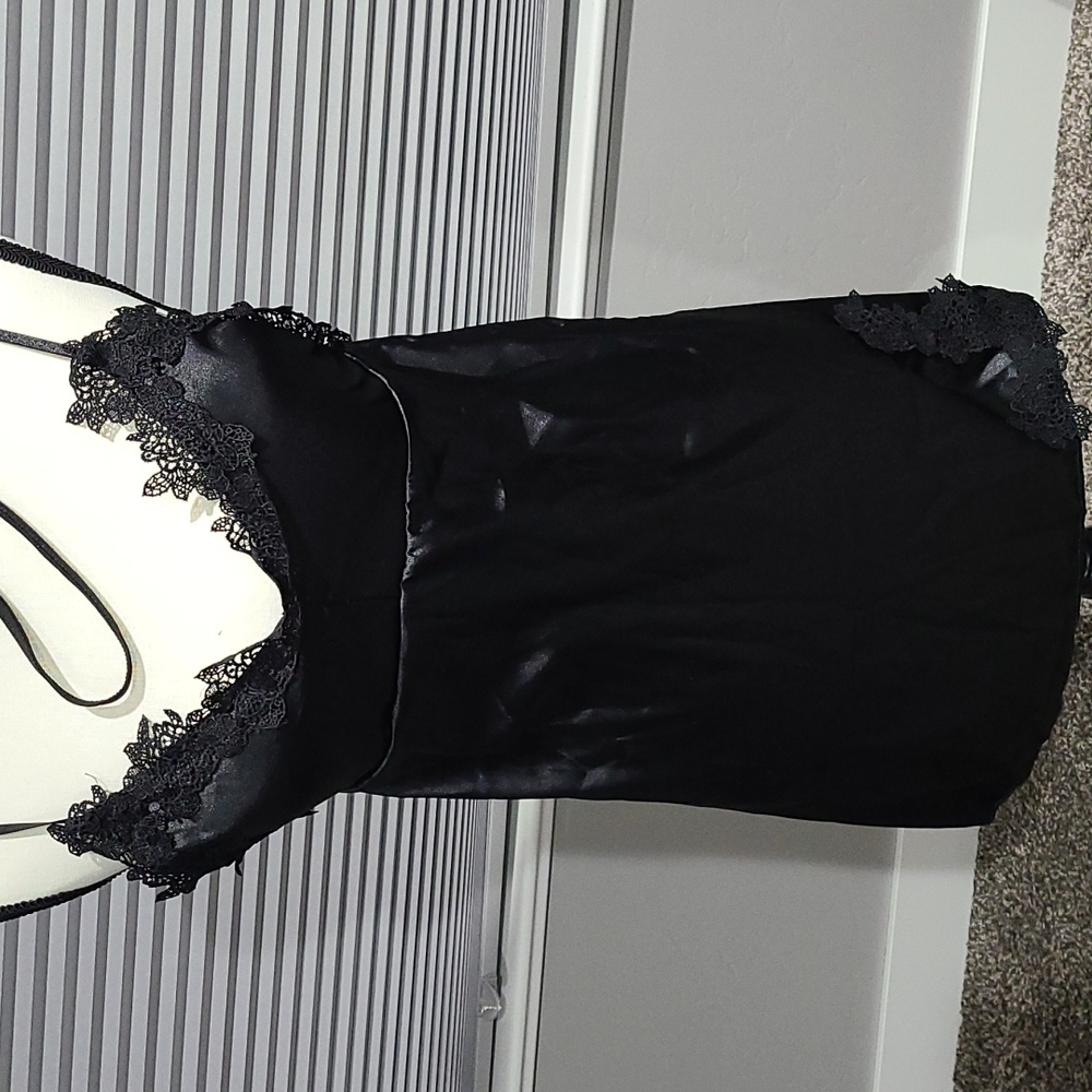 Black nightie with thong underwear, size M, no name brand new in bag.